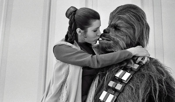 Princess Leia and Chewbacca in a tender moment onset, c. 1980