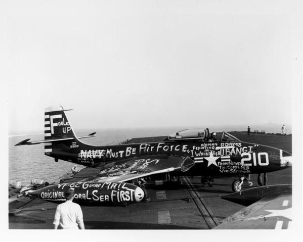 Members of the VF-62 squadron &quot;decorate&quot; a plane that landed on the wrong carrier,