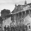 Red Army soldiers pose in front of the Reichstag 1945