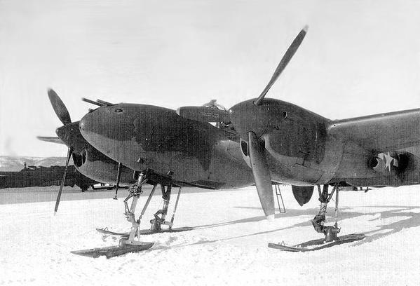 An uncommon sight of a P-38 J with skis in place of the wheels.