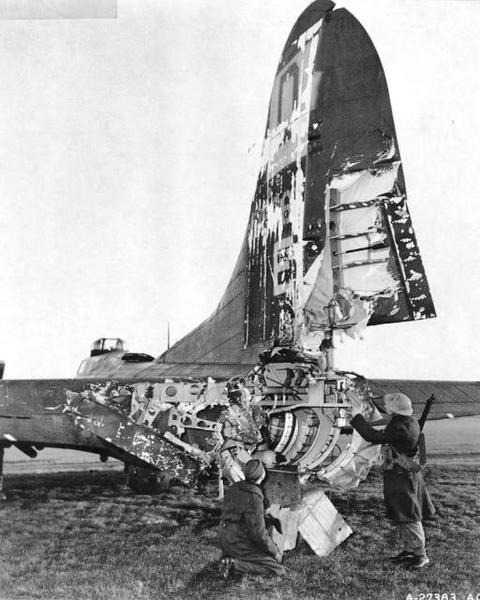 B-17 of the 100th Bomber Squadron of the USAAF rests in an English airfield after being severely damaged by flack over Frankfurt. She was eventually repaired and returned to normal duty, 1944