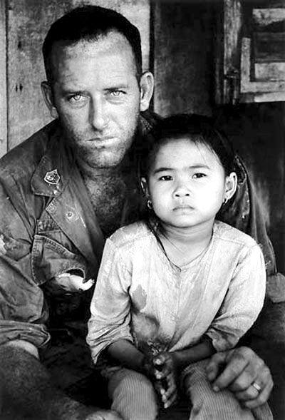 US soldier with a South Vietnamese child, Vietnam