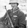 A young German soldier with an MP40 in the Russian winter snow