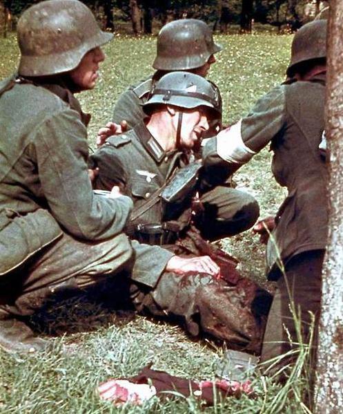 Wounded german soldier and a dismembered limb in foreground. Eastern front. WW 2