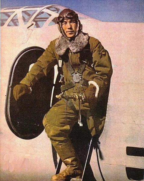 A Japanese army air force pilot with his Mitsubishi Ki-21 bomber aircraft, 1942