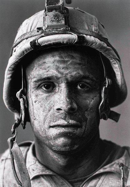 U.S. Marine Carlos 'OJ' Orjuela was photographed by Louie Palu after a mission in Helmand province.