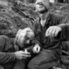 Helicopter crew chief James C. Farley shouts to his crew while wounded pilot Lt. James E. Magel lies dying beside him, Vietnam March 31, 1965.