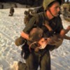 US Marine Medic Running Along Beach with Injured Vietnamese Infant under Fire During Vietnam War