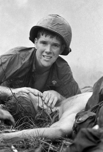 Medic James Callahan attempts to save an injured soldier during the Battle of Saigon