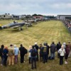 Crowds gather to see Hurricane and Spitfire planes before they participate in a flypast over Biggin Hill airfield in Kent