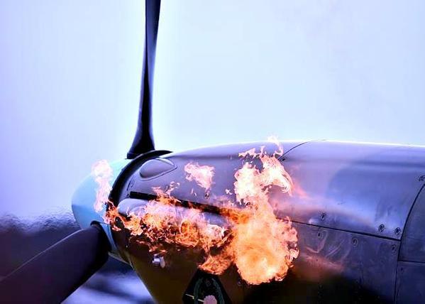 Flames are seen from the exhaust pipes of a Hurricane aircraft as the engine is started