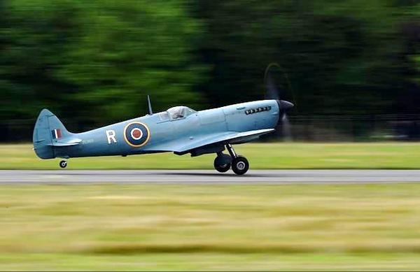 A Spitfire aircraft takes off from the airfield