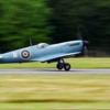 A Spitfire aircraft takes off from the airfield