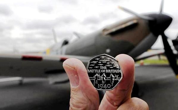 The Royal Mint’s Battle of Britain 50p commemorative coin, with a Mark I Spitfire that took part in the conflict being displayed at Humberside airport in Lincolnshire